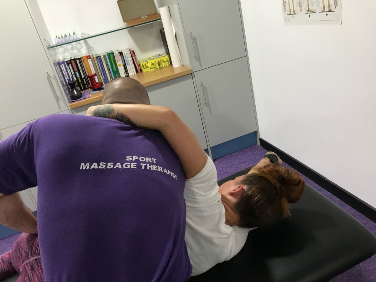 Craig Silkens performing sport massage treatment on a client